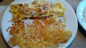 Meaty omelet with hash browns
