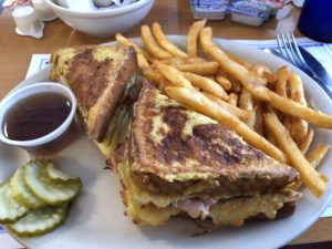 Monte Cristo with fries, a side of maple syrup, and the pickle slices no one eats